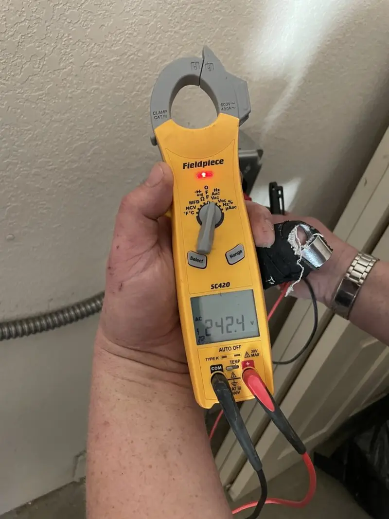Voltage testing with clamp meter during Outlet Installation in Blytheville